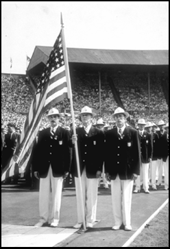 Ralph Craig carrying flag