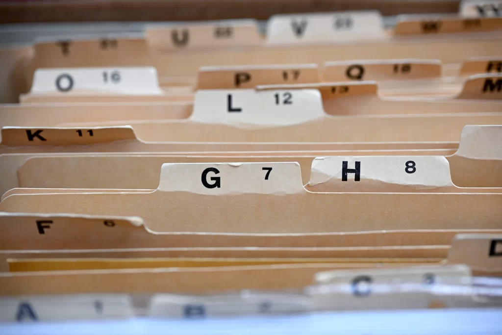 Small cards labeled with numbers and letters of the alphabet are ordered together.